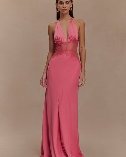 Front view of a women's pink halter neck maxi dress featuring a plunging neckline and sheer lace details.