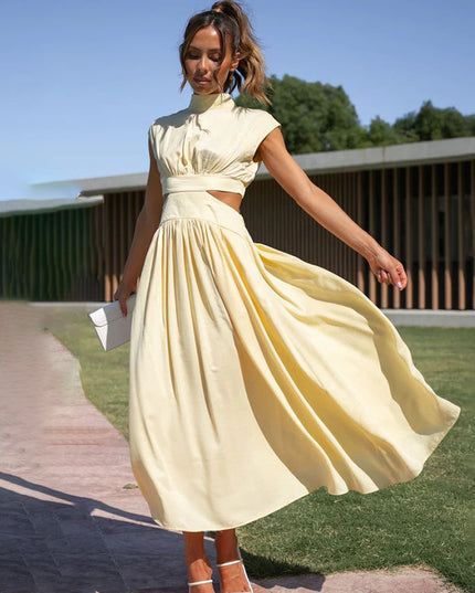 Light yellow high neck pleated midi dress with side cut-outs, full skirt, and cap sleeves.