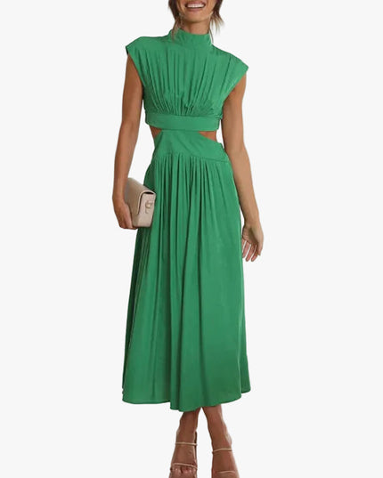 Green high neck pleated midi dress with side cut-outs and cap sleeves, styled with a clutch.
