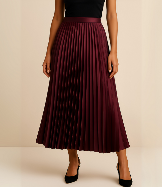 Rich burgundy high waisted pleated satin midi skirt for women, styled with black closed-toe heels.
