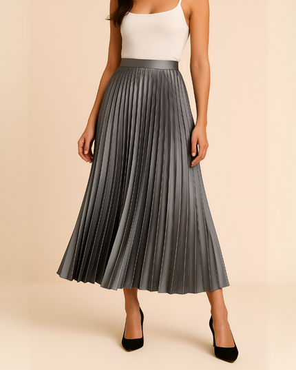 Elegant grey high waisted pleated satin midi skirt, shown with a white top and black heels.