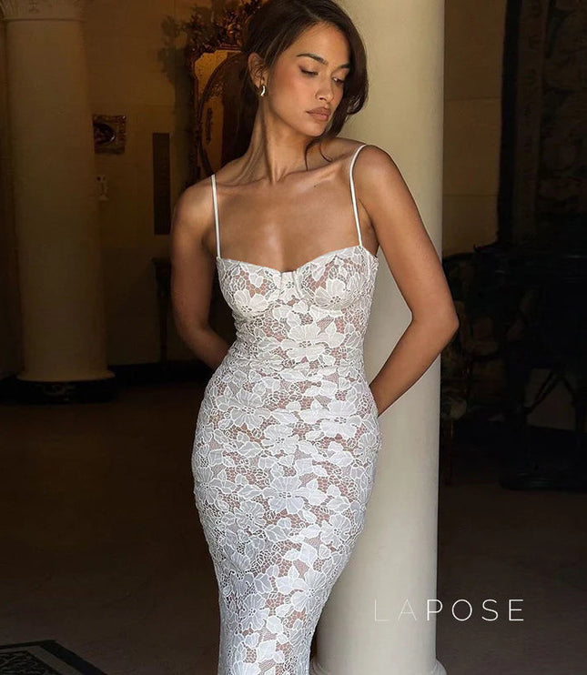 White lace backless spaghetti strap midi dress with a fitted silhouette, showcasing delicate floral lace over a nude lining.