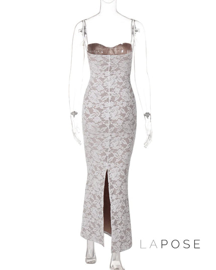 Back view of a white lace backless spaghetti strap midi dress with a subtle slit at the hem.