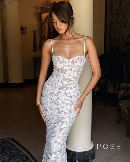 Fitted white lace midi dress with thin spaghetti straps and a sweetheart bust, highlighting the detailed floral lace design.