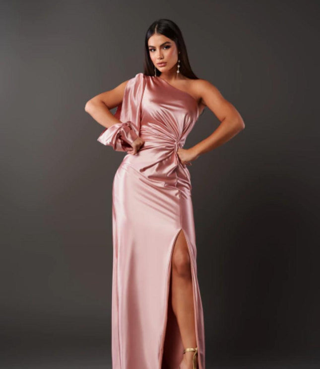 Light pink one shoulder ruched maxi dress with a high slit, showcasing the elegant satin fabric of the women's dress.