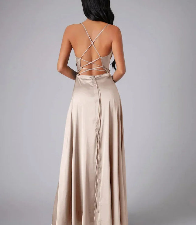 Back view of champagne satin cowl neck maxi dress with criss-cross spaghetti straps and a zipper closure.