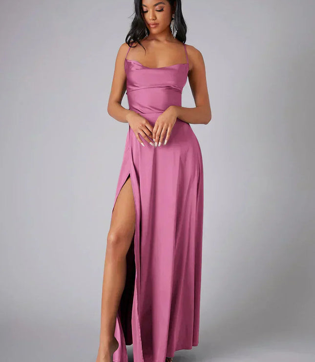 Pink satin cowl neck maxi dress with spaghetti straps and a high slit, front view.