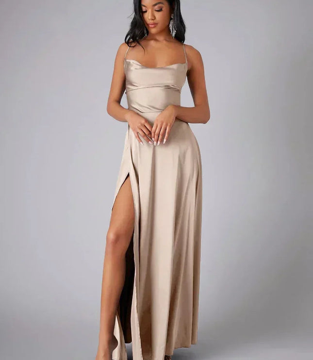 Champagne satin cowl neck maxi dress with spaghetti straps and a high slit, front view.
