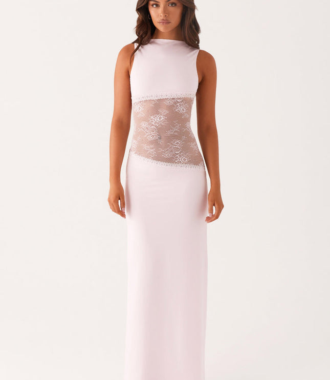 Pale pink sleeveless maxi dress with a boat neck and delicate lace cut-out panels on the waist, creating a soft, elegant aesthetic.