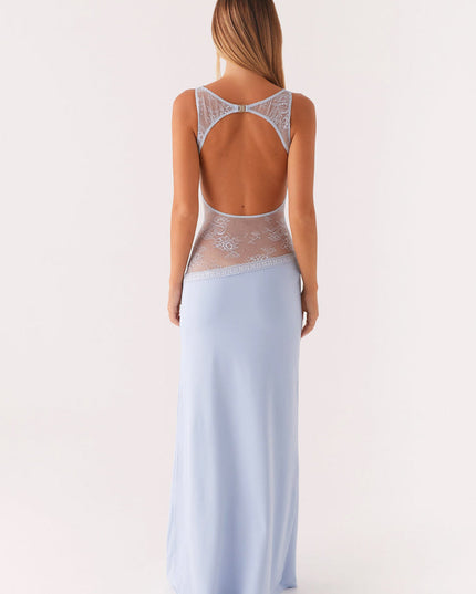 Rear view of a light blue sleeveless maxi dress, showcasing the open back and delicate lace details on the shoulders and waist.