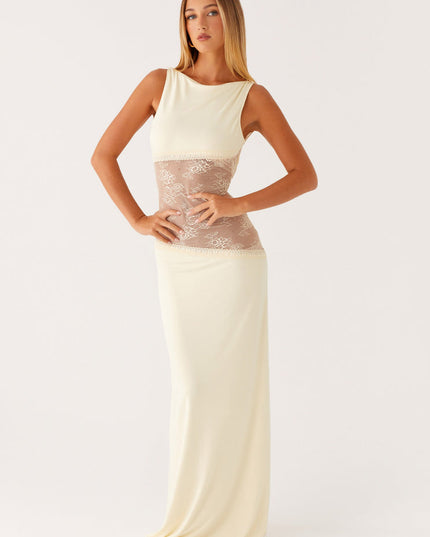 Full length front view of an ivory sleeveless maxi dress with a high neckline and elegant lace cut-out details on the bodice.