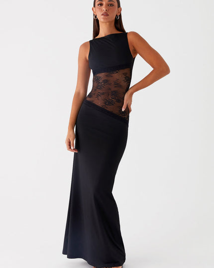 Elegant black sleeveless maxi dress with a boat neck and sheer lace panels on the waist, creating a silhouette.