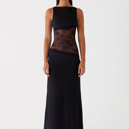 Sleeveless black maxi dress with intricate lace cut-out details on the torso, featuring a sleek, form-fitting silhouette.