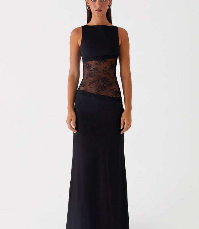 Sleeveless black maxi dress with intricate lace cut-out details on the torso, featuring a sleek, form-fitting silhouette.