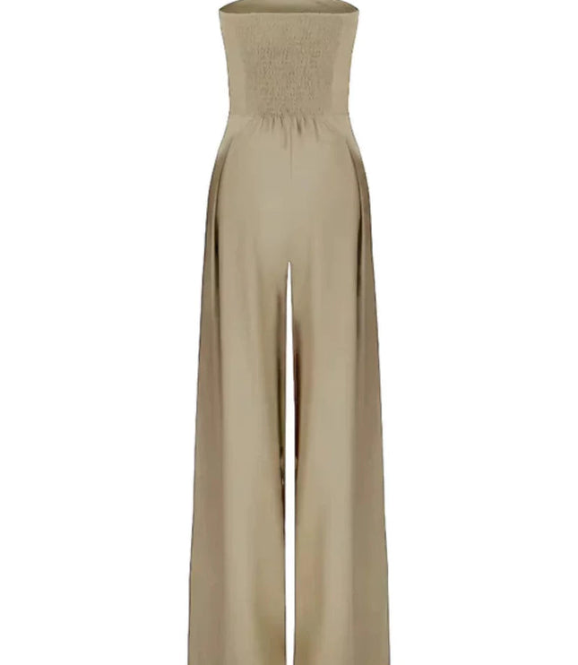 Beige strapless jumpsuit shown flat with smocked back and flowing wide leg pants