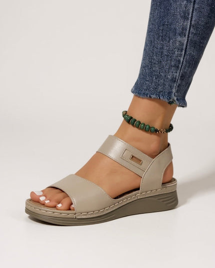 Beige leather platform sandals with dual straps and metallic buckle closure
