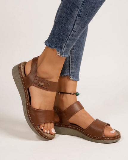 Brown leather platform sandals with dual straps and contrast stitching detail