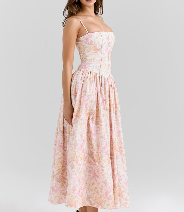 Side profile of the women's floral corset midi dress, highlighting the fitted bodice and flowing skirt design.