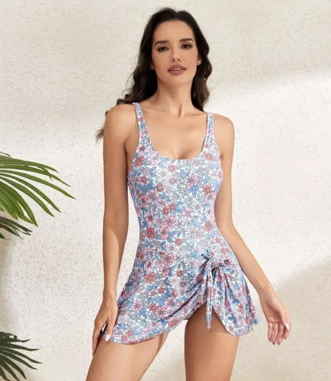Pastel floral swimsuit dress with scoop neck and ruched side tie detail