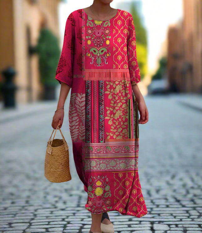 Women summer printed maxi dress in pink shown on a model with long sleeves and mixed print design
