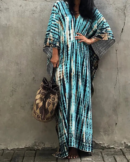 Turquoise tie dye maxi dress with oversized sleeves and long flowing hem for beach summer wear
