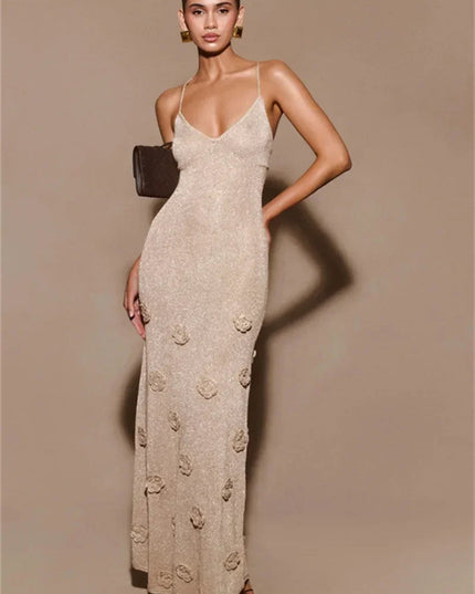 Champagne-colored V-neck maxi dress with delicate spaghetti straps and textured 3D floral details, ideal for summer weddings.