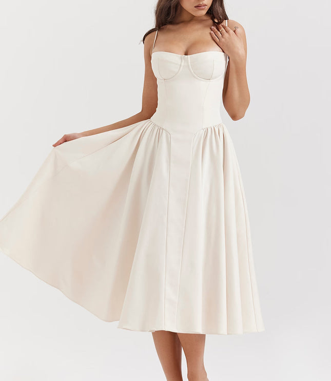 Cream corset midi dress side view with flowing skirt and pockets
