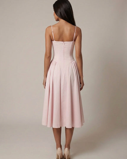 Back view of blush corset midi dress showing zip closure