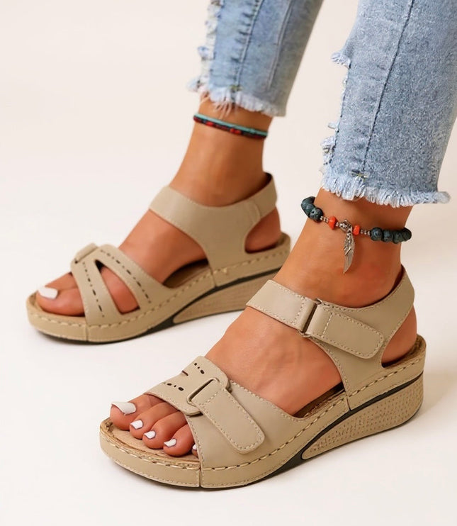Beige adjustable platform sandals with dual buckle straps and cushioned wedge