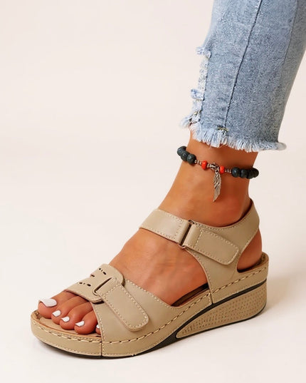 Tan platform sandals with adjustable velcro straps and contoured footbed