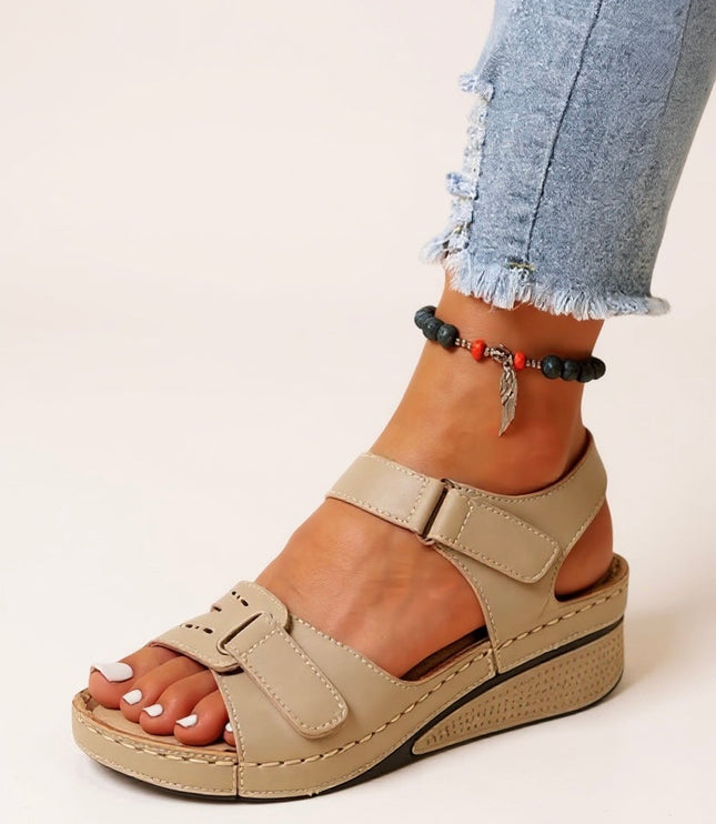 Tan platform sandals with adjustable velcro straps and contoured footbed