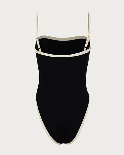 Front view of black one piece bathing suit with cream bandeau neckline