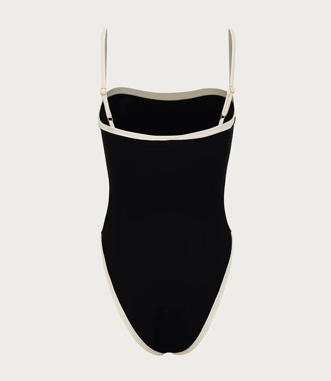 Front view of black one piece bathing suit with cream bandeau neckline