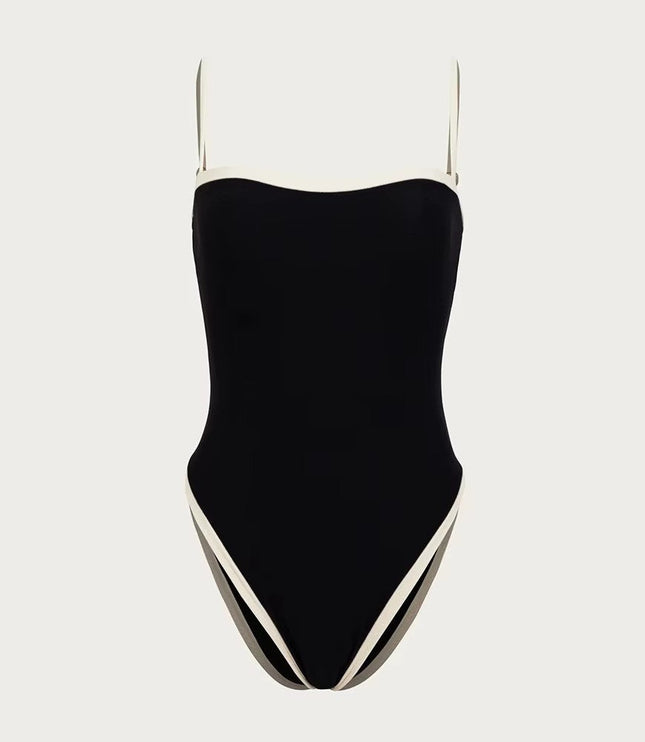Black one piece swimsuit with contrasting white side panels and straps