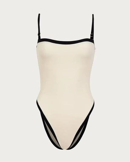 Cream bandeau one piece swimsuit with black trim and high leg cut