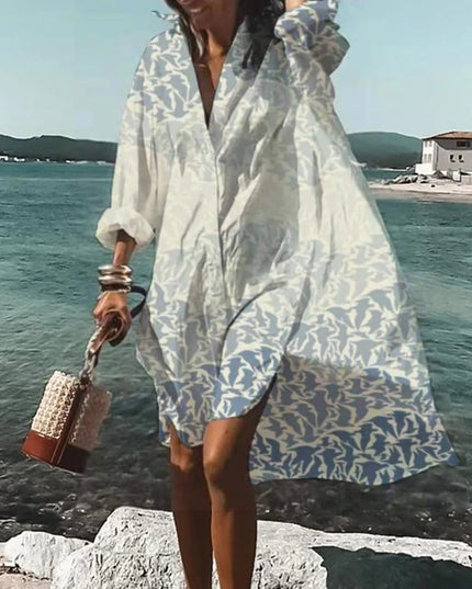 White beach mini shirt dress with pale leaf print, long sleeves, and relaxed loose fit