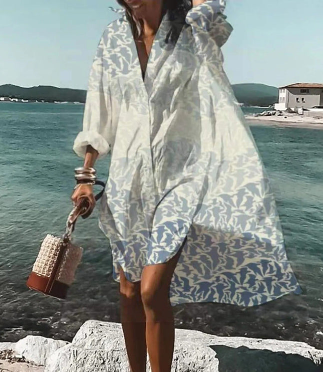 White beach mini shirt dress with pale leaf print, long sleeves, and relaxed loose fit