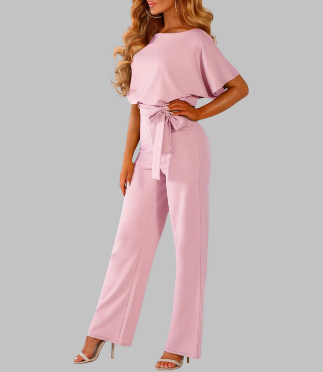 Pink belted wide leg jumpsuit with batwing sleeves and tie belt