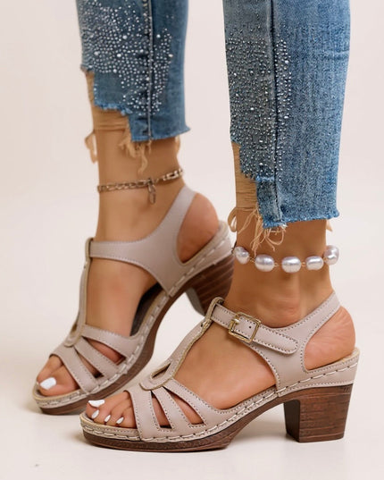 Dark navy strappy sandals with chunky block heel, platform base, and buckle ankle strap