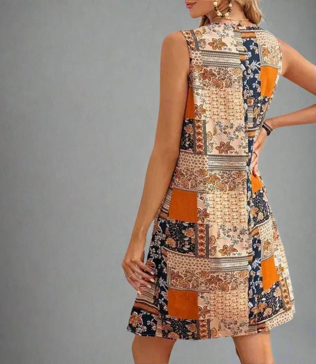 Back view of sleeveless summer patchwork mini dress with orange floral panels