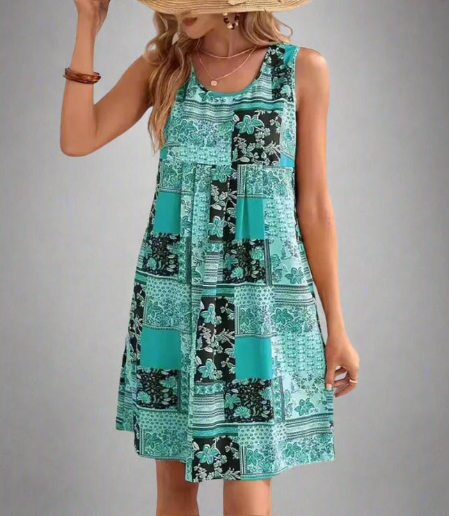 Sleeveless patchwork mini dress in teal and black floral print with summer style
