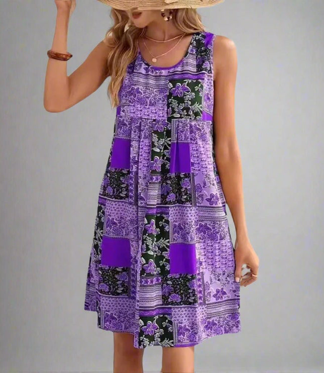 Sleeveless summer patchwork mini dress in purple and black floral print panels