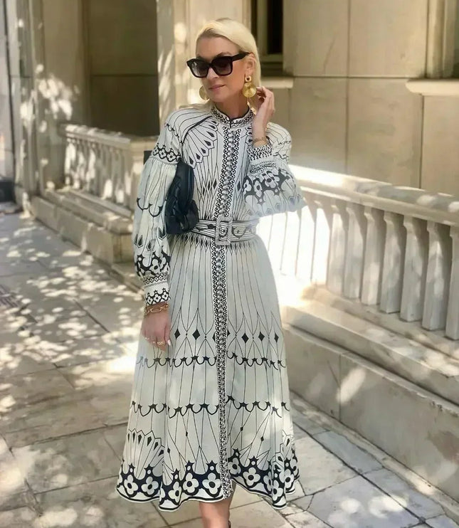 Long sleeve A line midi dress with black geometric print and high neck detail