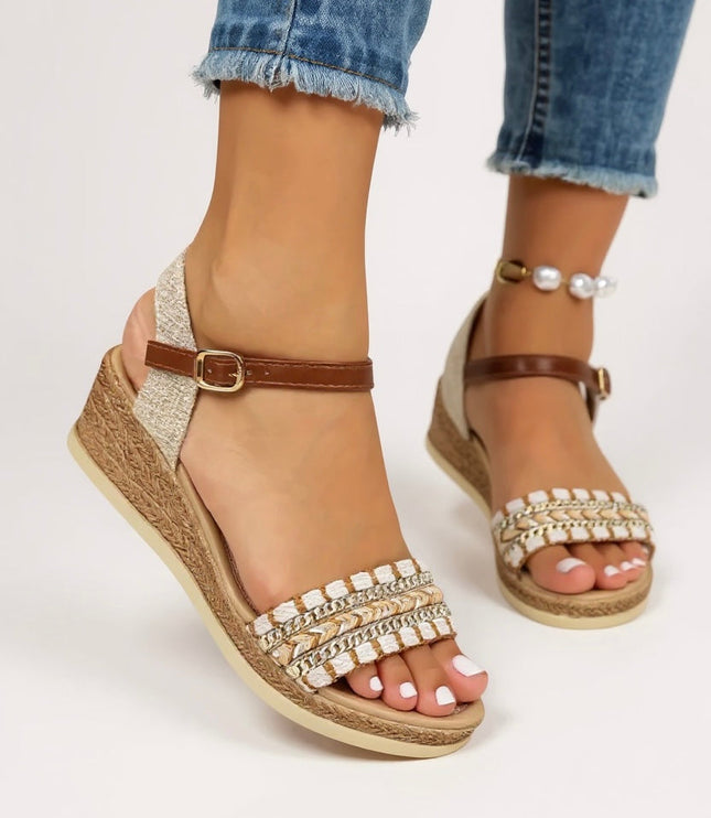 Side profile of women's braided wedge sandals with chain detail and buckle ankle strap