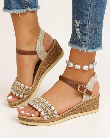 Front view of platform sandals with woven wedge heel, chain-detailed footbed, and brown straps