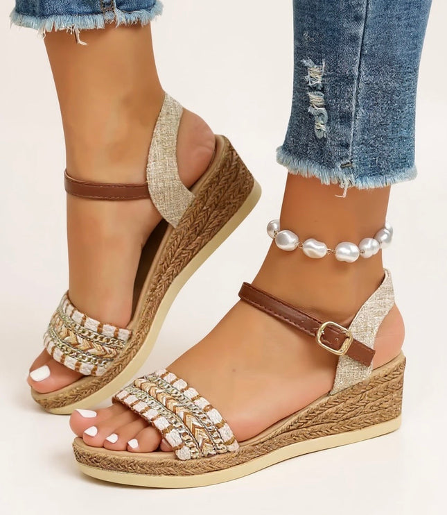 Front view of platform sandals with woven wedge heel, chain-detailed footbed, and brown straps
