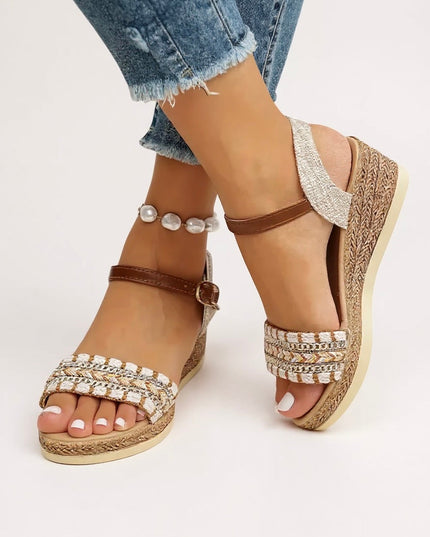 Braided wedge sandals with chain detail and brown ankle strap, worn with pearl bracelet