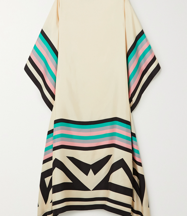 Back view of cream maxi dress with geometric black and multicolor striped hem detail