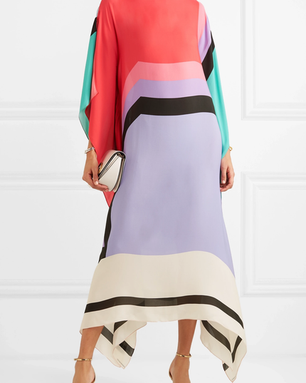 Color block maxi dress in coral, lavender, and cream with black and white striped details