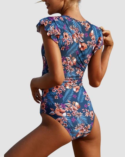 Back view of tropical floral one piece bathing suit with ruffled sleeves
